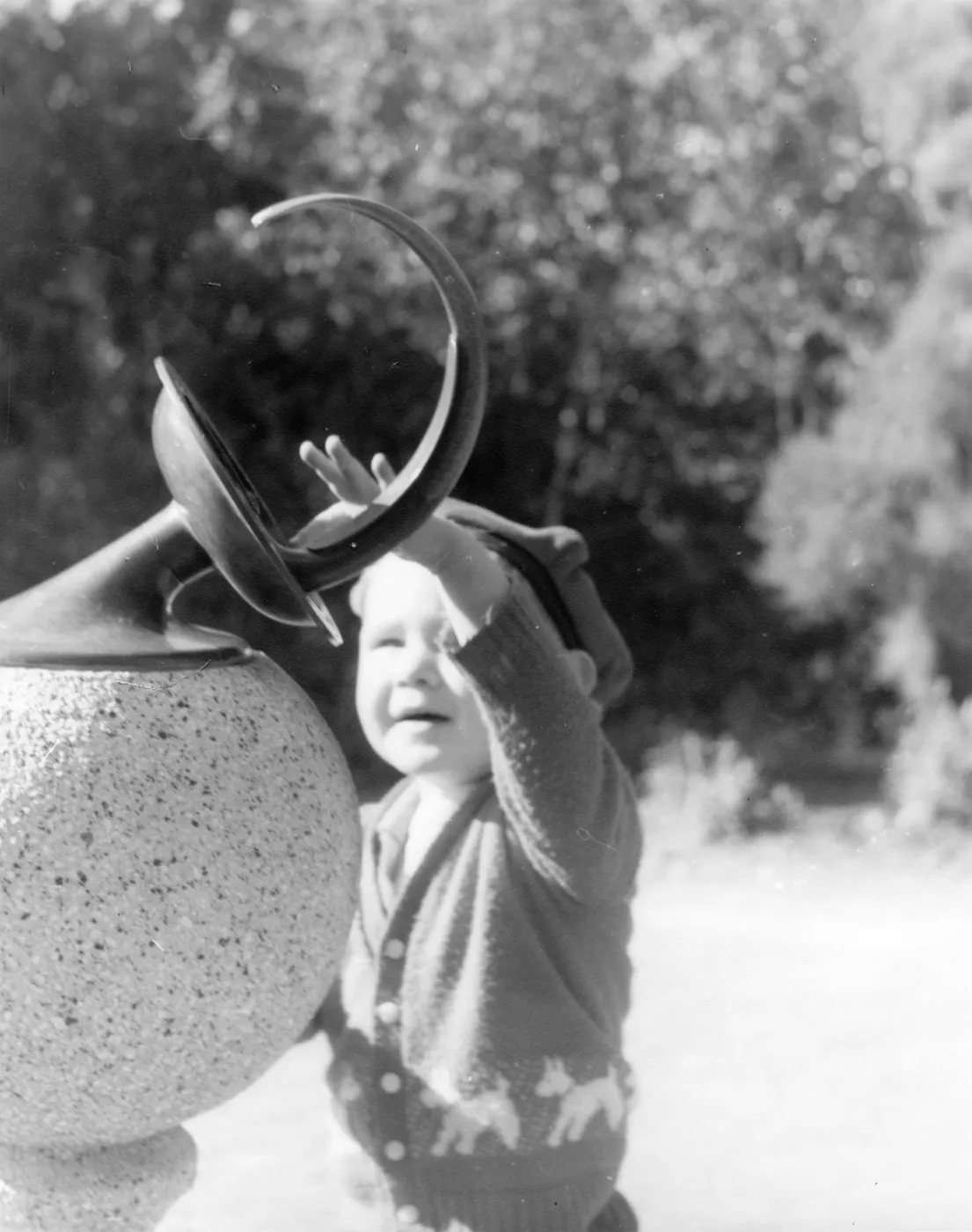 Child touching SBBG Sundial