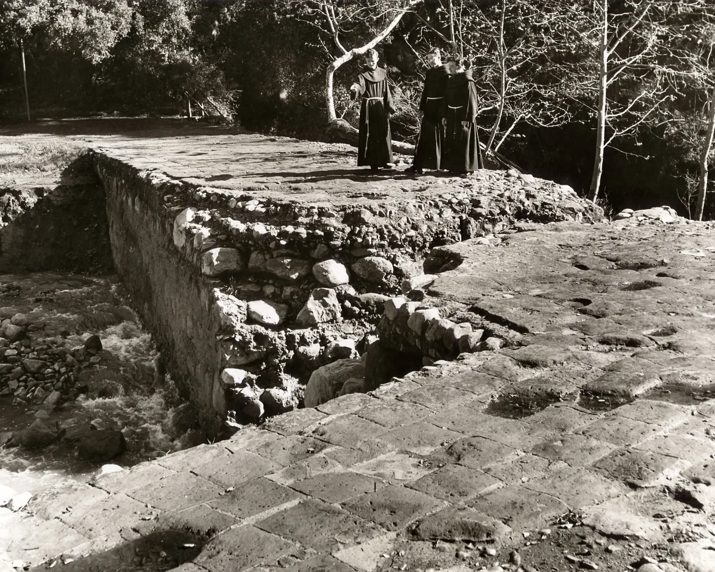 Franciscan Padres on old Mission Dam, before 1940