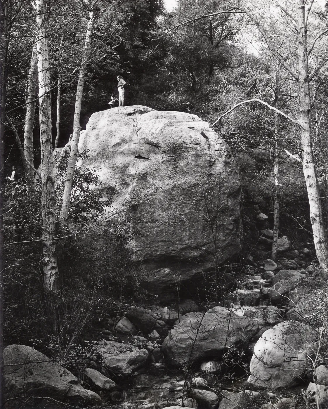 people standing on top of Lassiter Boulder
