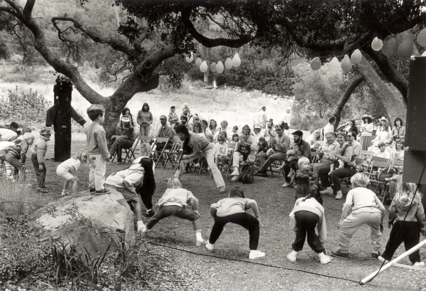 Family Festival, SBBG. Billy B performing with children and a tree; audience of parents and children.