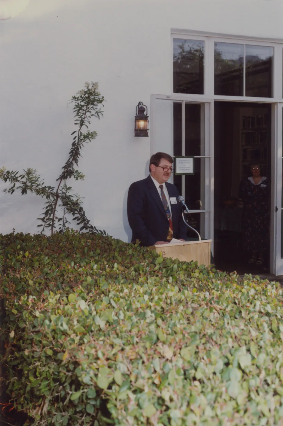 Ed Schneider speaking in front of Blaksley Library, Blaksley Library's 50th Anniversary Celebration