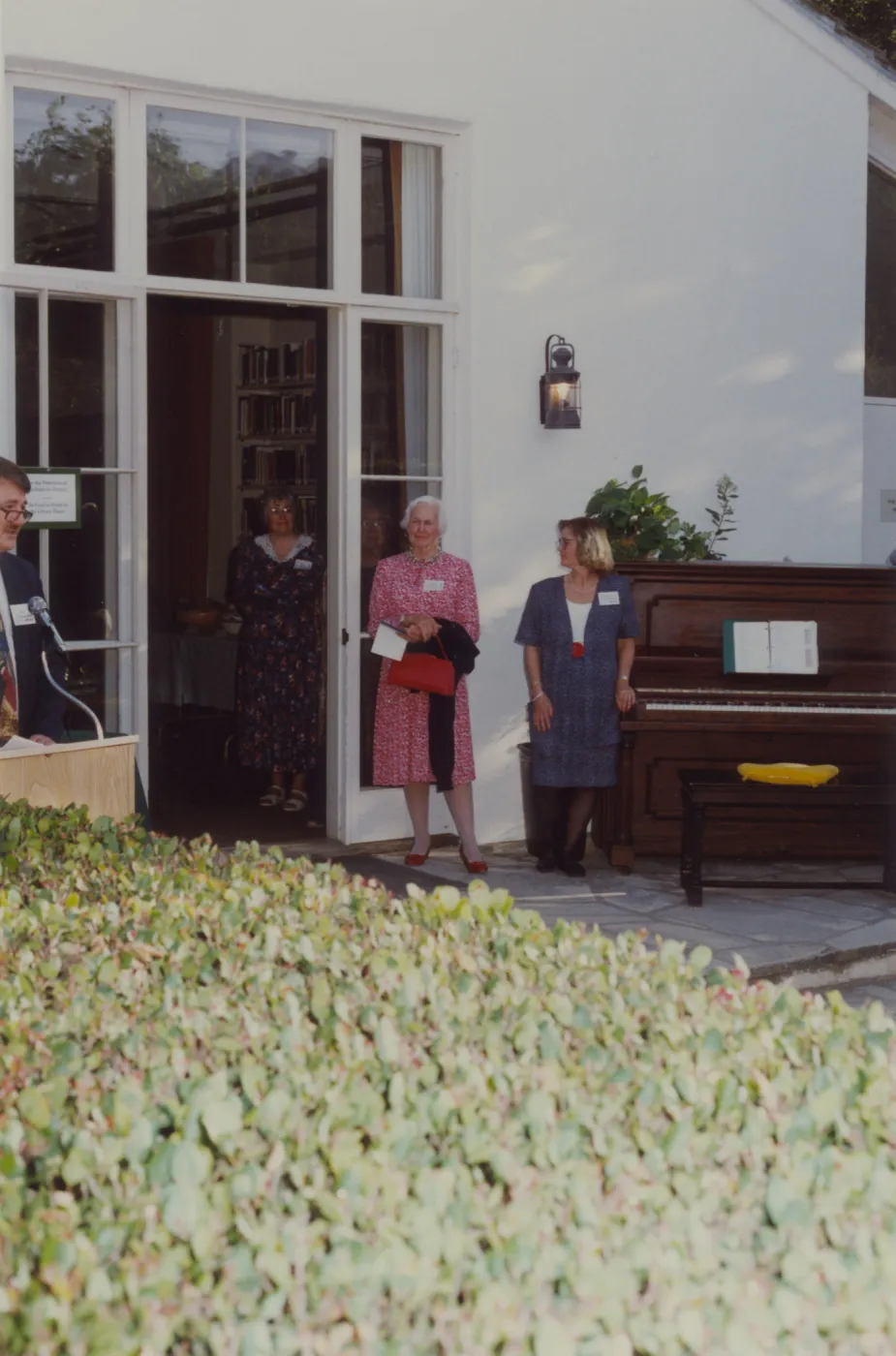 Piano and ladies in front of Blaksley Library