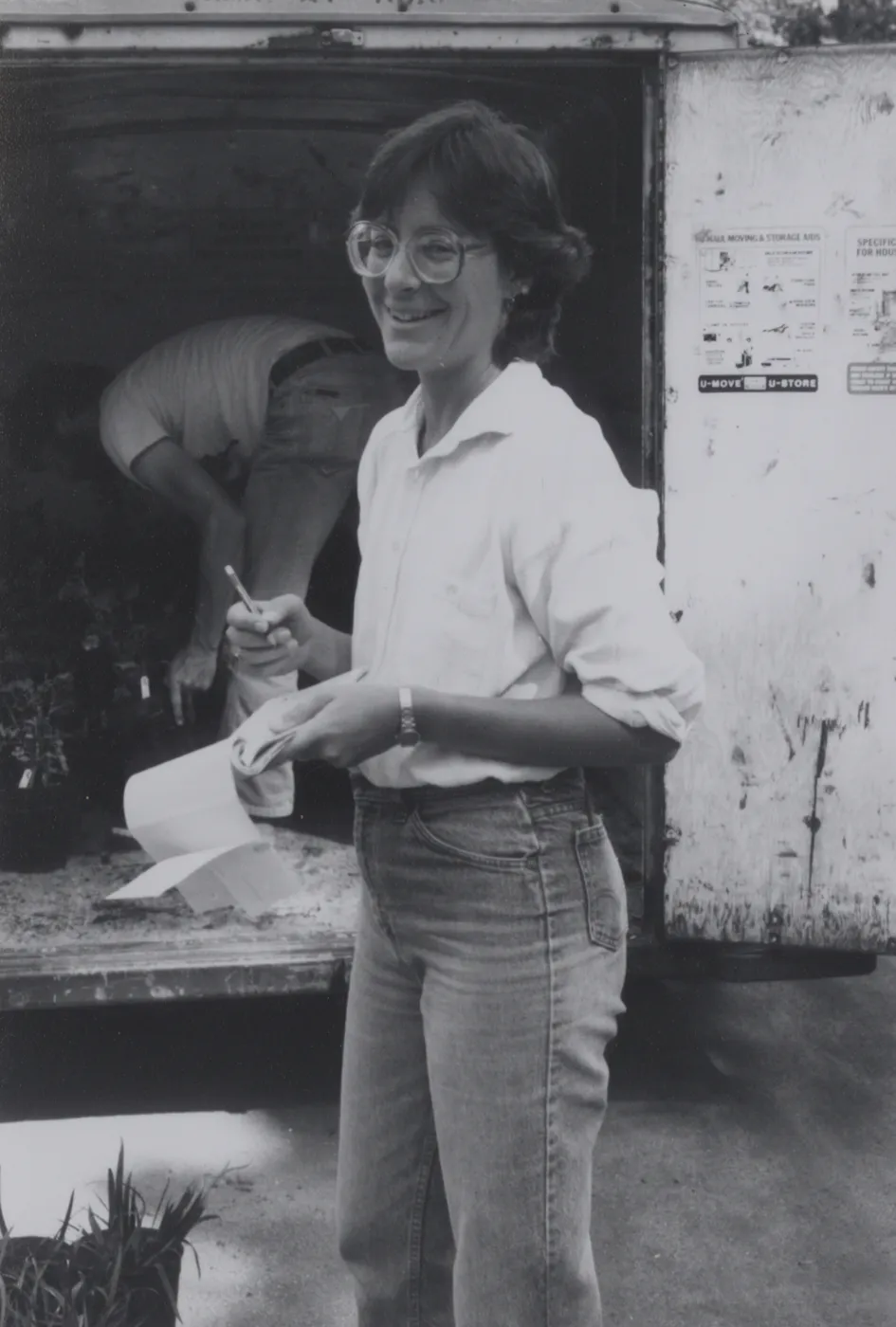 Plant Propagator Carol Bornstein prepares for plant sale, October 1984