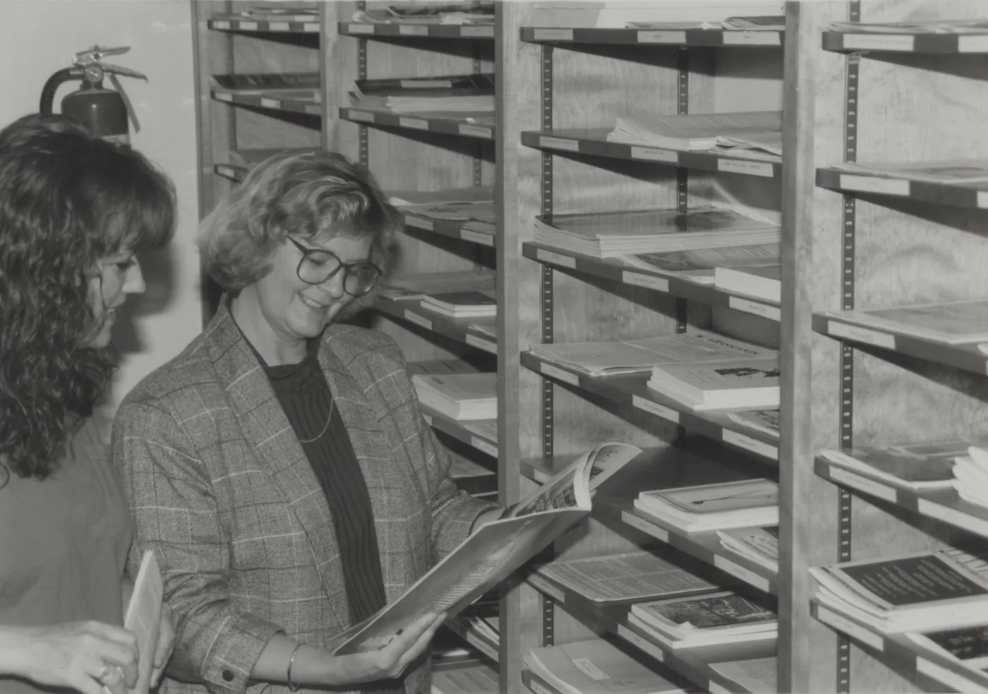 Librarian Becky Eldridge with Library patron in Library Annex