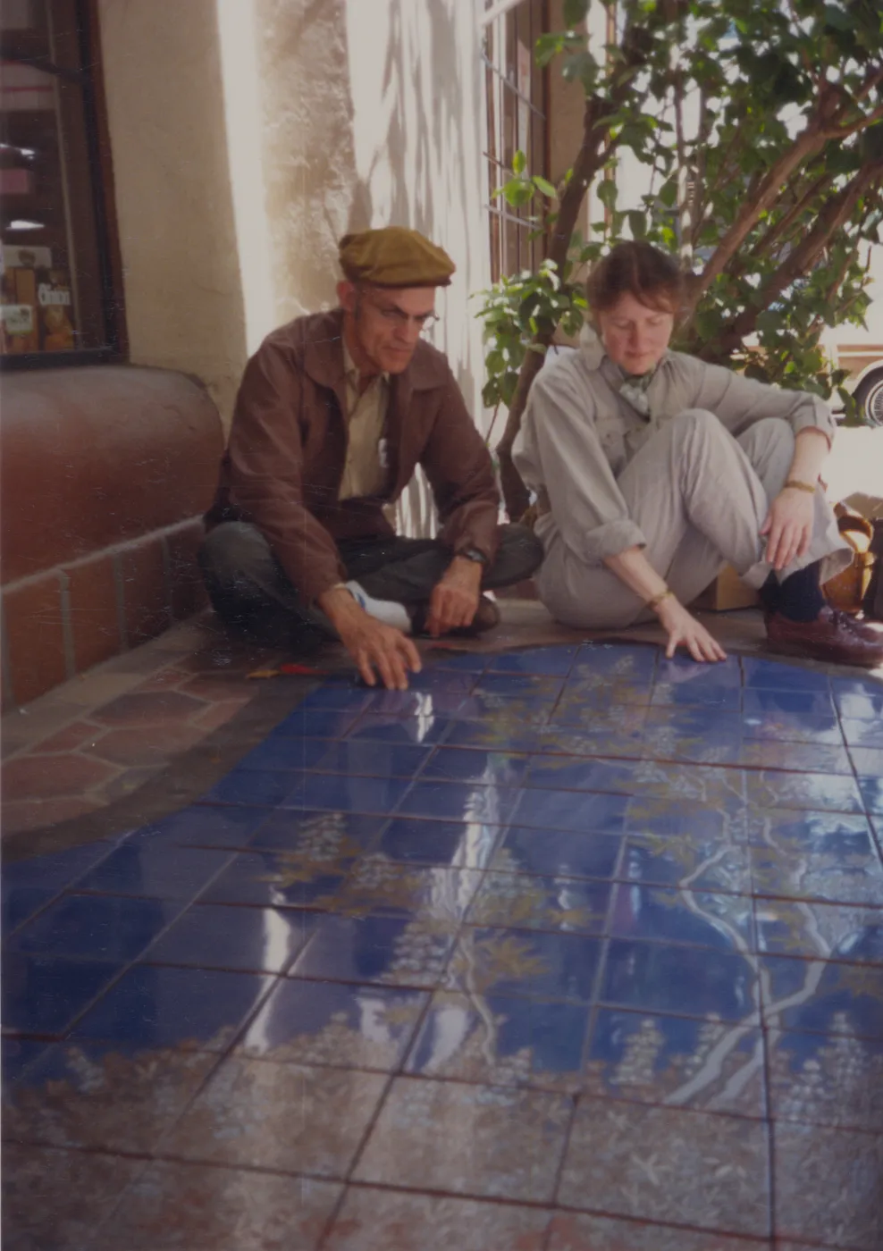 Dara Emery and Judy Sutcliffe with La Arcada tile fountain