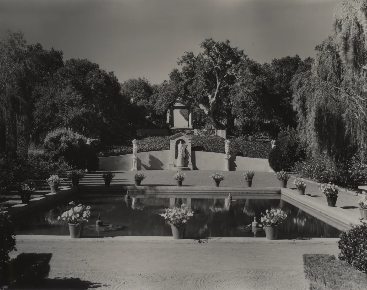 Formal garden with pool and sculptures in Montecito