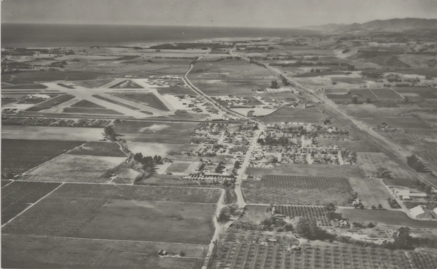 Aerial view of old town Goleta, airport, 101 freeway, and surrounding farms