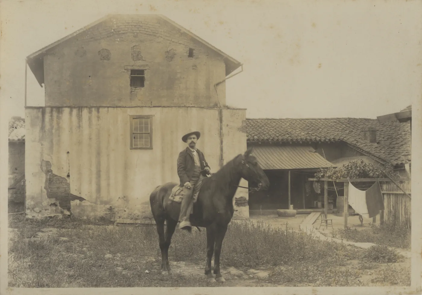 Man on Horseback at rear of Casa de la Guerra c. 1870s