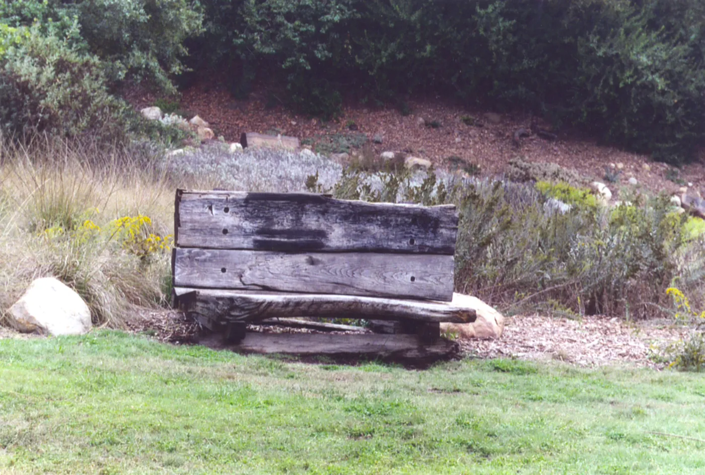 old wood bench (formerly placed in front of Blaksley Boulder)