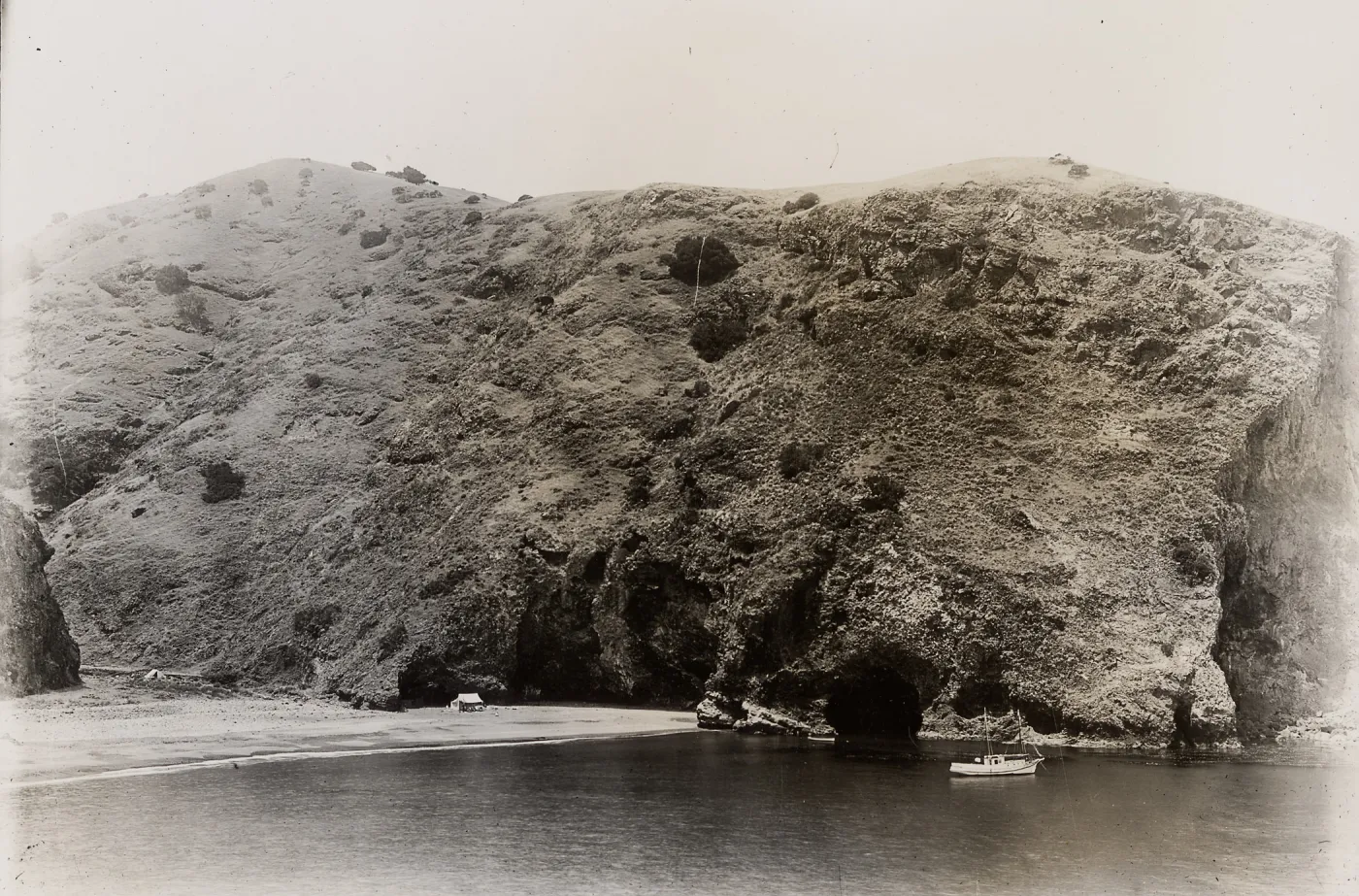 boat in harbor and tent camp on beach, Santa Cruz Island