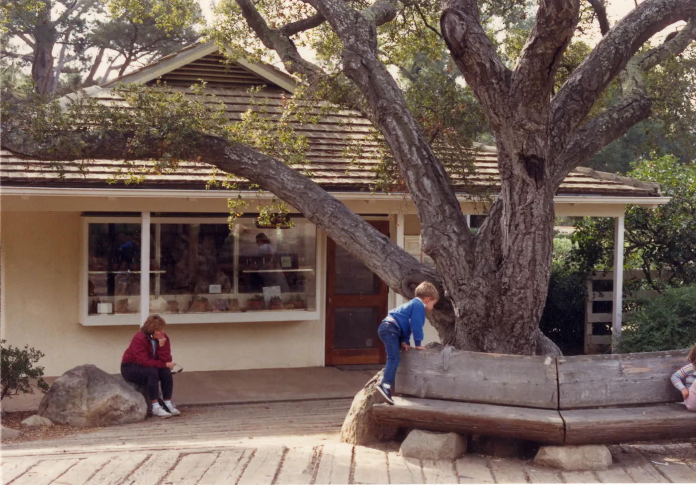 Gift shop exterior, railroad tie decking, wood bench by entrance oak