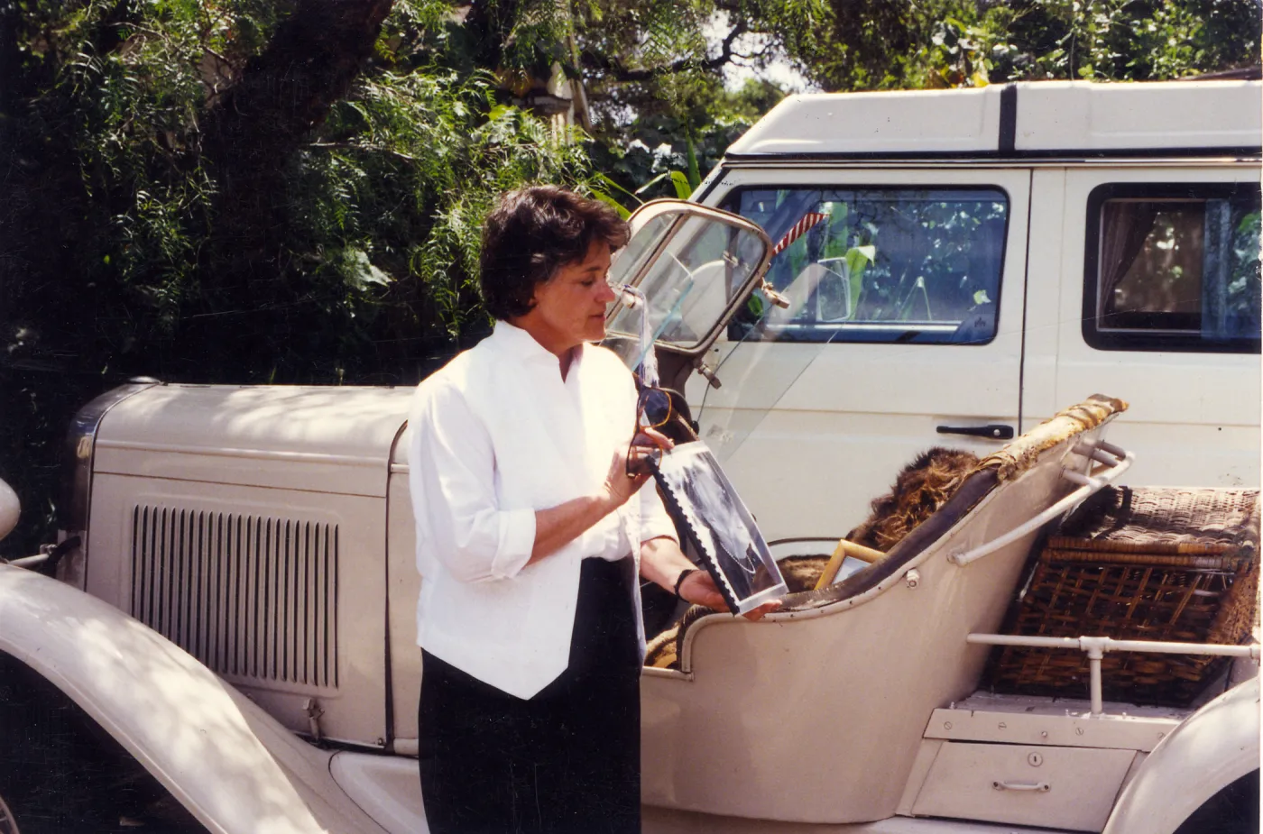 Sydney Baumgartner with picture of Elizabeth de Forest, car is Lockwood de Forest's â€˜Buffalo'