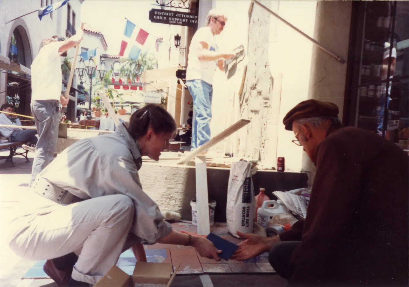 Judy Sutcliffe & Dara Emery put together lupine design on tiles for La Arcada fountain