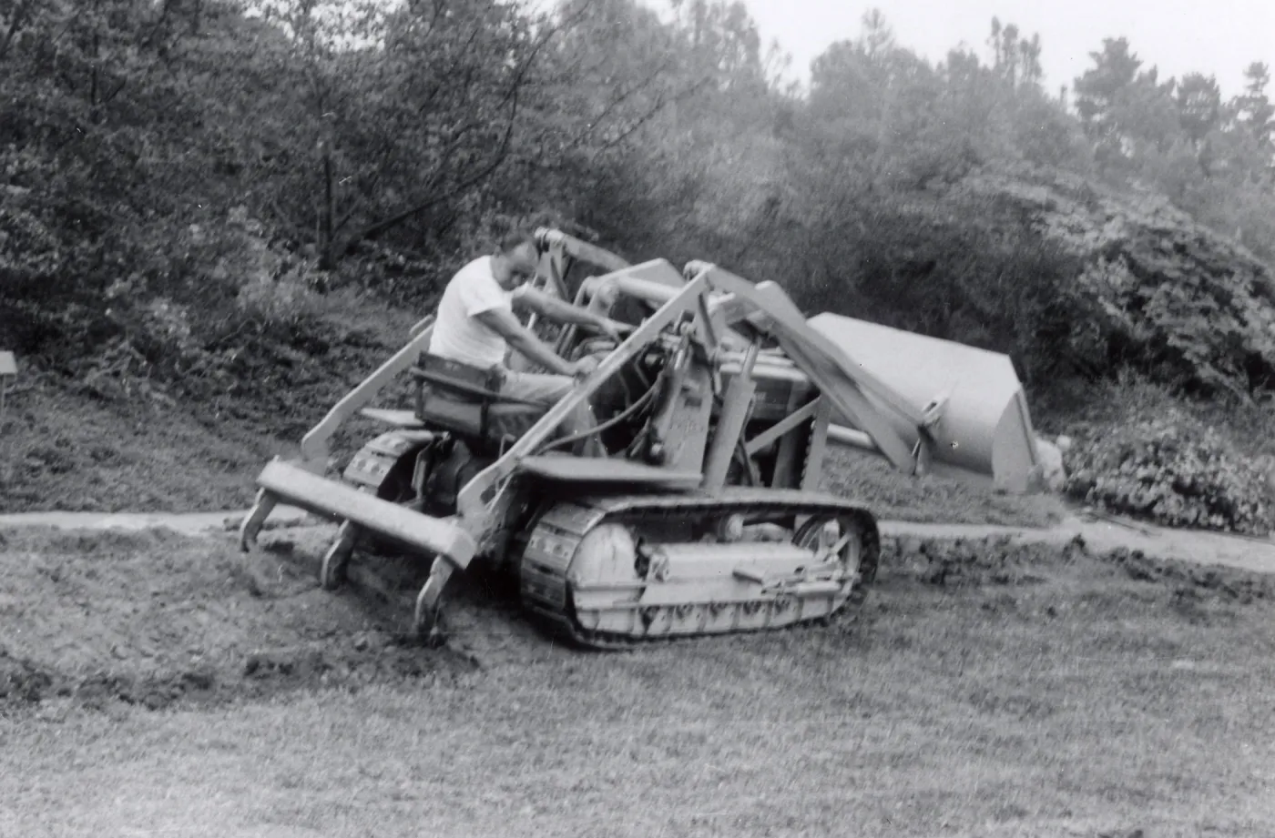 Miscellaneous Grounds Work, Jose Torres uses the new tractor to break up soil in the meadow border