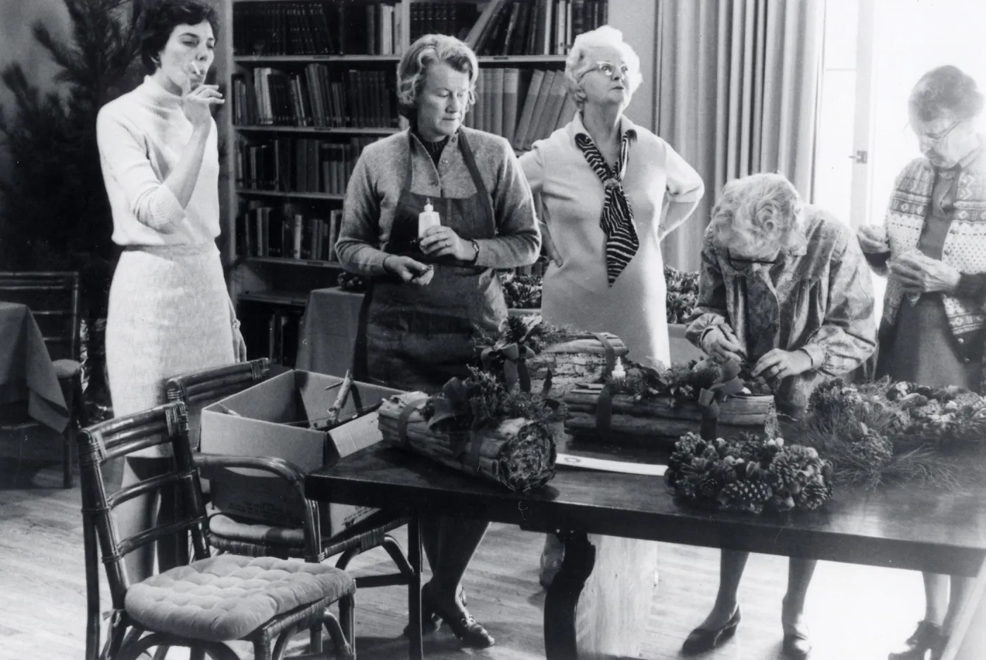 Garden Guild preparing Library for annual Holiday Sale, Jackie Broughton on left