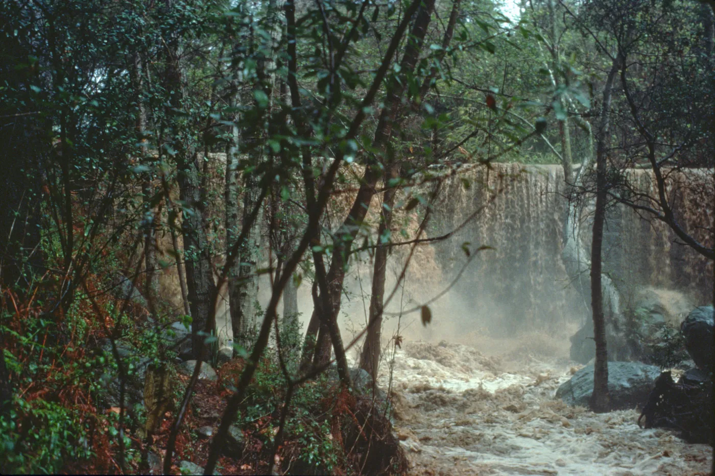 Torrential flooding of Mission Creek over Mission Dam