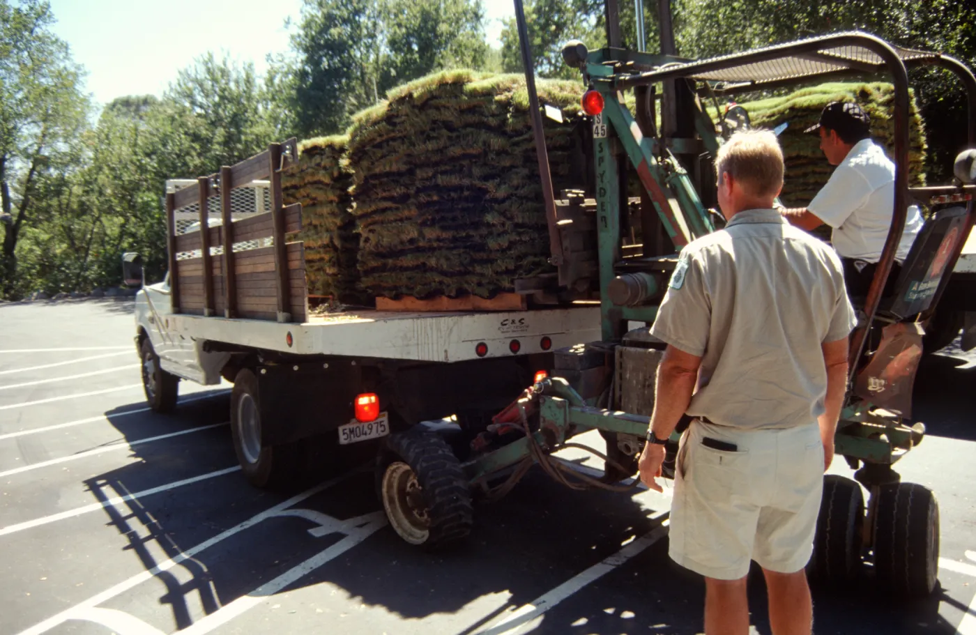 tractor unloading sod for the new Meadow lawn Installation