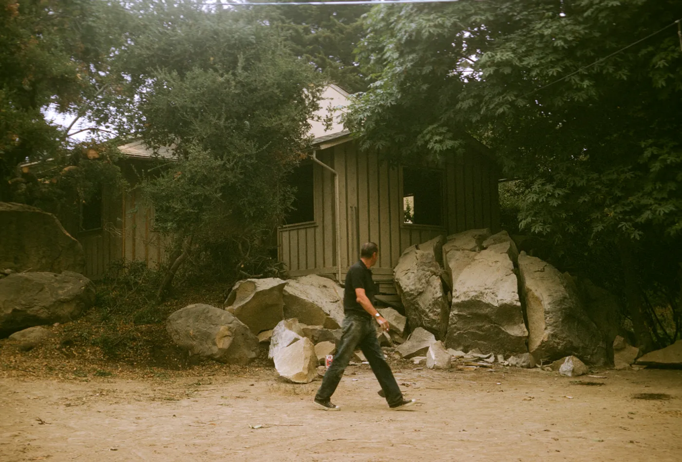 Herbarium Construction. View of pre-herbarium building showing dynamited boulders