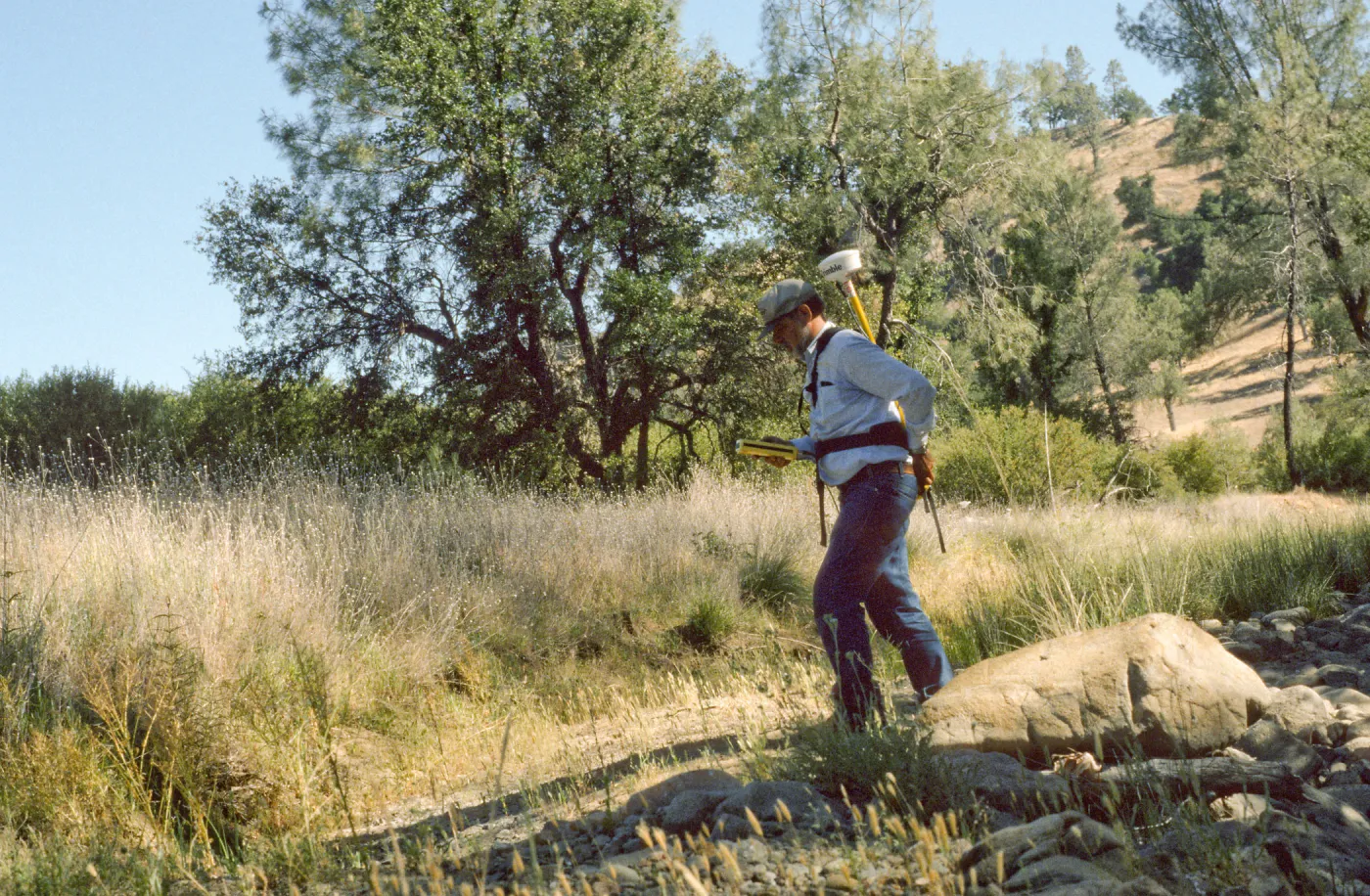 Dieter Wilken mapping rare plants with backpack GPS unit, Fort Hunter Liggett