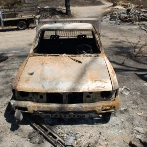 burned trucks parked at Gane House after the Jesusita Fire