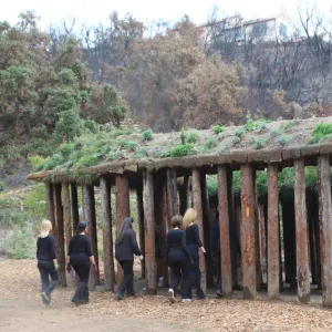 Art from the Ashes, dancers with Herb Parker's â€˜Haven' labyrinth sculpture