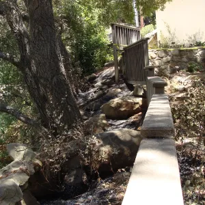 wood railing on the west side of the Cottage, after the Jesusita Fire