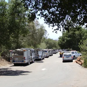 Parking lot with Santa Barbara fire vehicles and firefighters at the Santa Barbara Botanic Garden, after the Jesusita Fire