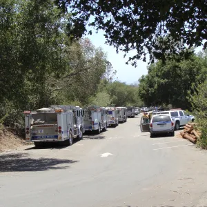 Parking lot with Santa Barbara fire vehicles and firefighters at the Santa Barbara Botanic Garden, after the Jesusita Fire