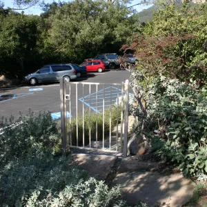 metal gate between Mission Canyon Road and the parking lot