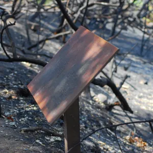 fire damaged sign after the Jesusita Fire
