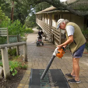 Geege Ostroff cleaning the SBBG mat