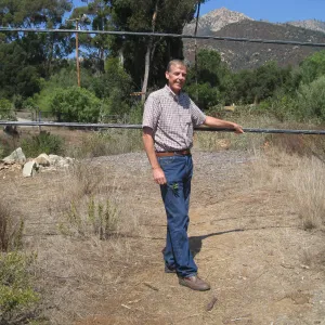 Bob Muller with sagging power lines at Tunnel Road gate