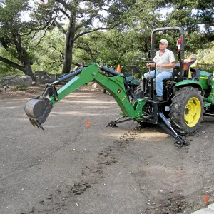 Dave Kershaw digging holes for new oak trees in the Meadow Oaks