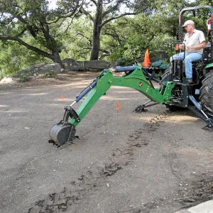 Dave Kershaw digging holes for new oak trees in the Meadow Oaks