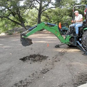 Dave Kershaw digging holes for new oak trees in the Meadow Oaks