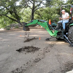 Dave Kershaw digging holes for new oak trees in the Meadow Oaks