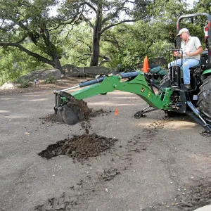 Dave Kershaw digging holes for new oak trees in the Meadow Oaks
