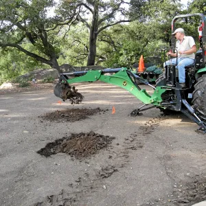 Dave Kershaw digging holes for new oak trees in the Meadow Oaks