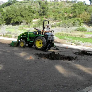 Dave Kershaw digging holes for new oak trees in the Meadow Oaks