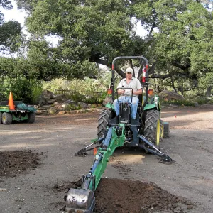 Dave Kershaw digging holes for new oak trees in the Meadow Oaks