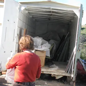 SBBG Staff cleaning out temoporary storage container, after the Jesusita Fire