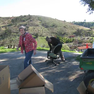 SBBG Staff cleaning out temoporary storage container, after the Jesusita Fire