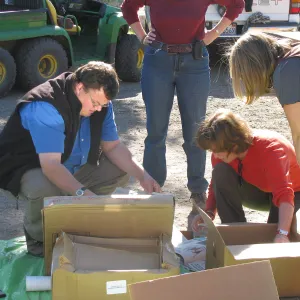 andrew Wyatt, Betsy Collins, Tricia Wardlaw, SBBG Staff cleaning out temoporary storage container, after the Jesusita Fire