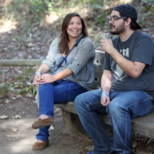 Santa Barbara Beer Garden Event, visitors seated on a wood bench