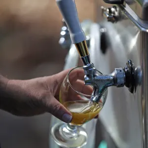 Santa Barbara Beer Garden Event, fresh pour from the tap, Garden logo beer glass
