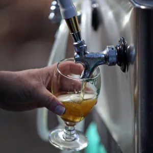 Santa Barbara Beer Garden Event, fresh pour from the tap, Garden logo beer glass