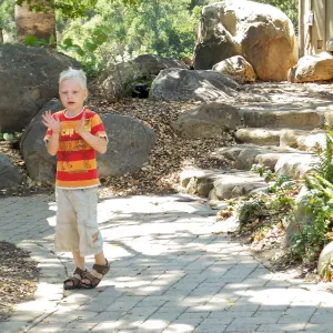 Trails n Tails 2014, boy playing near information kiosk