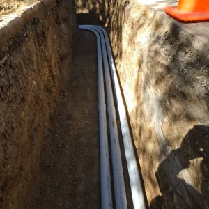 Power and data conduit being installed in the Arroyo Section
