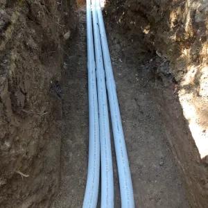 Power and data conduit being installed in the Arroyo Section
