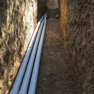 Power and data conduit being installed in the Arroyo Section